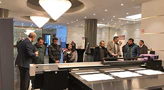 Mimaki Technology Promotion Tour people standing around printer