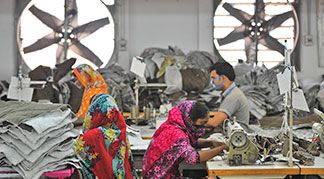 Production Relocates in Global Textile Market people working